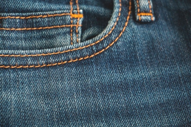 Fondo azul jean, dril de algodón con textura de costura de la tela.