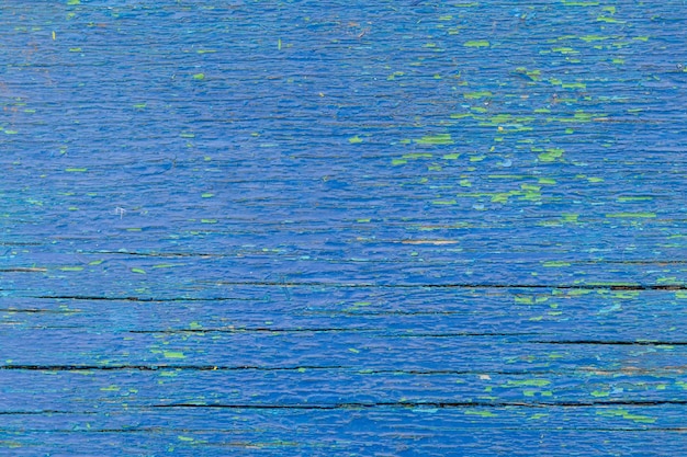 Fondo azul de madera vieja con toques verdes con espacio de copia de grietas Lugar para el texto Base para