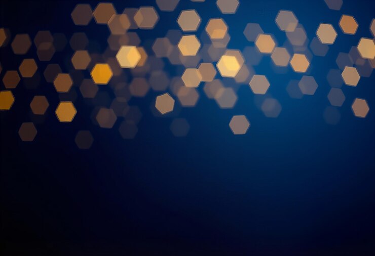 Foto un fondo azul oscuro con luces de estrellas doradas y bokeh