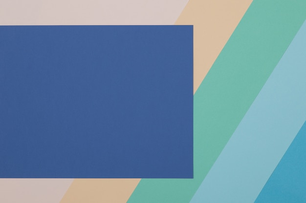 Foto fondo azul, verde, amarillo, el papel de color se divide geométricamente en zonas