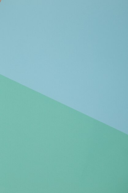 Foto fondo azul, verde, papel de color se divide geométricamente en zonas