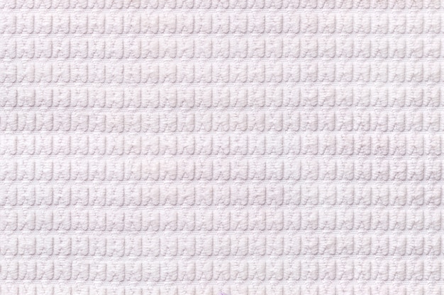 Fondo blanco de suave tejido lanoso de cerca, textura de textiles