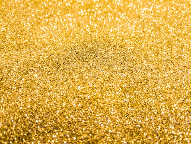 Foto fondo bokeh brillante y chispeante. oro amarillo - iluminación borrosa de la textura del brillo.