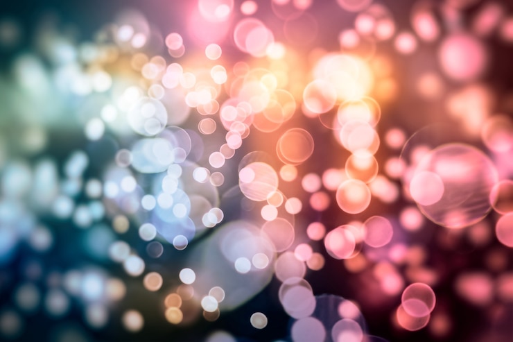 Foto el fondo de bokeh circular abstracto y brillante es borroso sobre un fondo oscuro