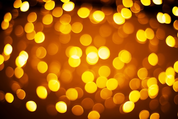 Fondo bokeh de luces amarillas y naranjas, bakcground de Navidad y año nuevo