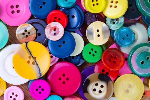 Fondo de los botones de coser Textura de los botóns de coser de colores