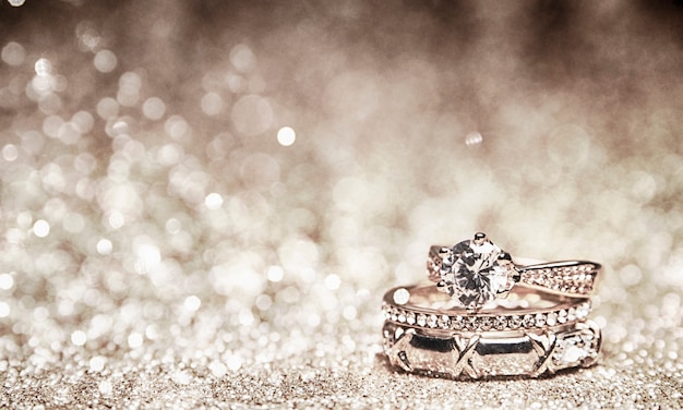 Foto fondo de brillo con anillos de boda