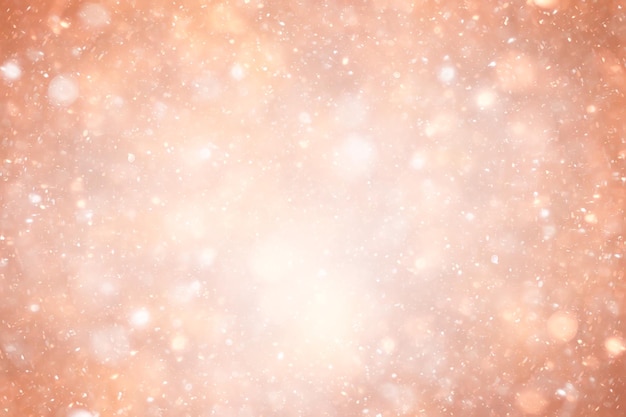 Fondo de brillo cálido abstracto de nieve, diseño de Navidad de invierno
