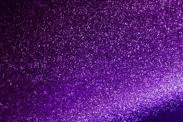 Fondo de brillo de chispa violeta púrpura abstracto