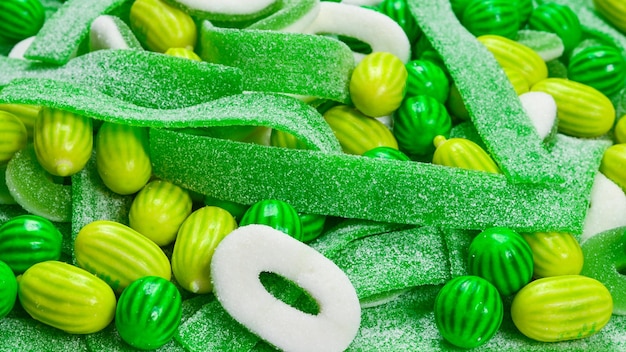 Fondo de caramelos gomosos verdes surtidos Vista superior Dulces de gelatina