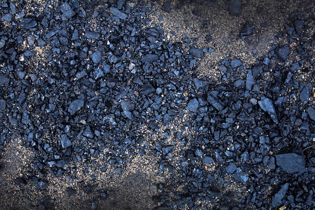Fondo de carbón negro de pequeñas partículas de carbón Fondo de textura