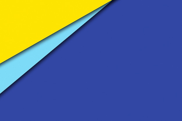 Fondo de cartón de composición geométrica azul y amarillo