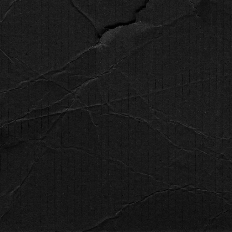 Foto el fondo de cartón negro arrugado