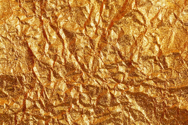 Fondo de cartón de textura de hoja de papel dorado