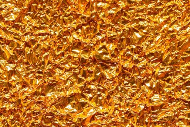 Fondo de cartón de textura de hoja de papel dorado