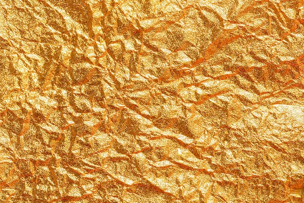 Fondo de cartón de textura de hoja de papel dorado