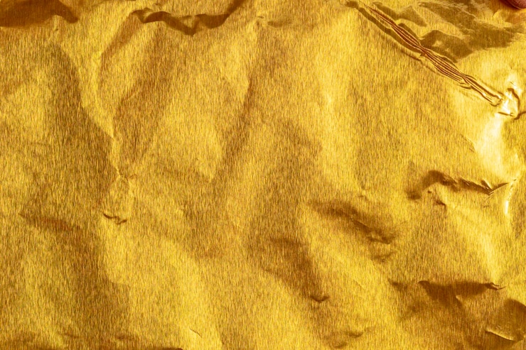 Foto fondo de cartón de textura de hoja de papel dorado