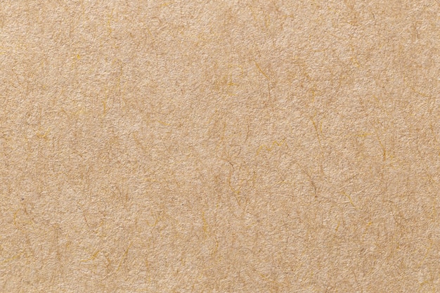 Fondo de cartón de textura de hoja de papel kraft reciclado eco marrón.