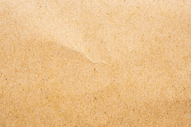 Fondo de cartón de textura de hoja de papel kraft reciclado ecológico marrón