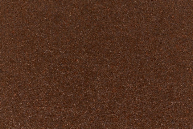 Fondo de cartón de textura de papel marrón oscuro. Foto de alta resolución.