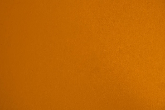 Fondo de cemento de pared de superficie naranja oscuro