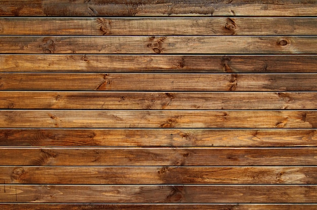 Foto fondo de la cerca de madera anudada natural. textura de madera.