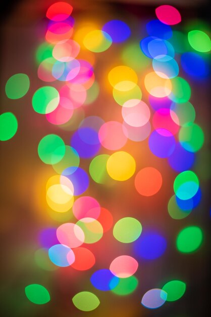 Foto fondo de círculo bokeh dorado y multicolor para navidad y feliz año nuevo con espacio