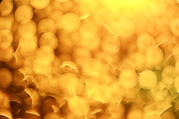 Fondo de círculos borrosos bokeh dorado, patrón de diseño borroso abstracto