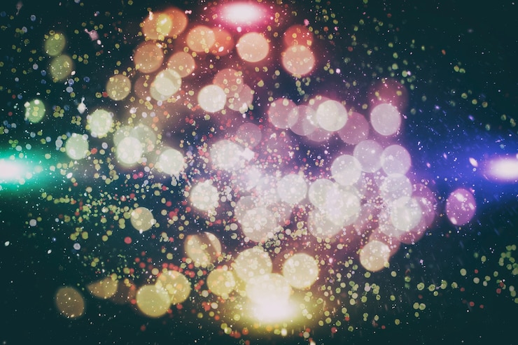 Foto fondo claro de navidad. telón de fondo brillante de vacaciones. fondo desenfocado con estrellas parpadeantes. bokeh borroso.