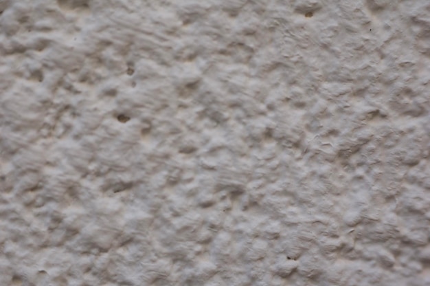 Fondo completo de una pared rugosa blanca