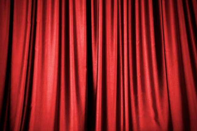 El fondo de la cortina roja del escenario