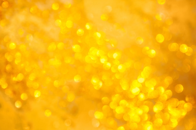 Fondo dorado bokeh para año nuevo, diseño navideño, luces borrosas