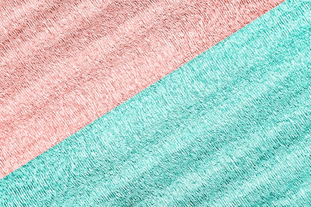 Fondo de dos colores menta y rosa con brillante superficie arrugada para el fondo de textura.