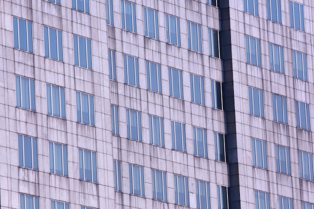 Fondo de edificio alto Lado del edificio con ventanas y puerta