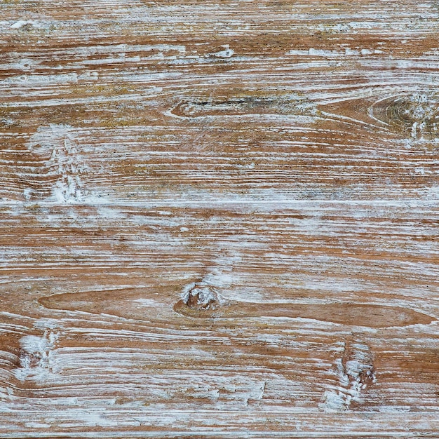 El fondo es de madera natural antigua con textura grunge de cerca.