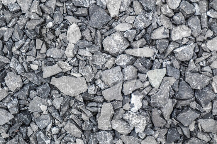 Fondo de escombros de piedra de tierra gris de muchas piedras pequeñas.