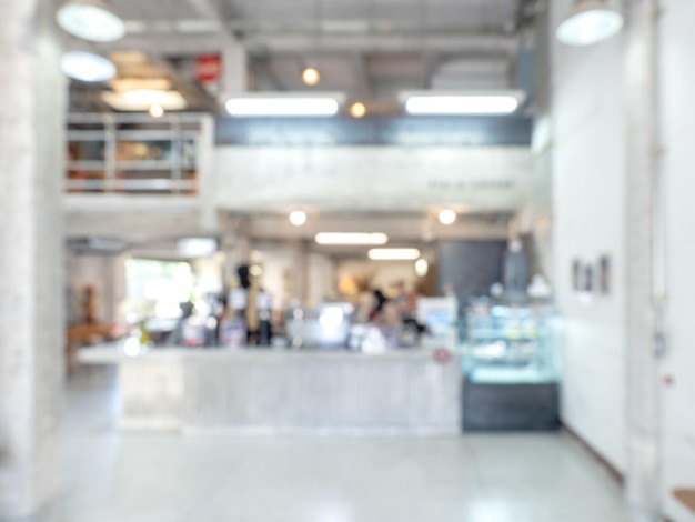 Fondo de espacio de trabajo de café blanco moderno borroso abstracto edificio de dos pisos oficina interior o espacio de sala de restaurante interior Fondos borrosos para publicidad y presentación de negocios