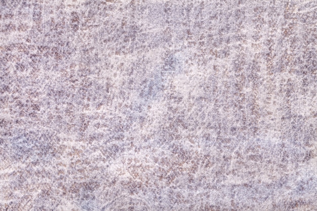 Fondo esponjoso gris claro y perla de tela suave y vellosa. Textura de textil de terciopelo marfil