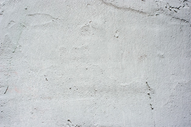 Fondo de un exterior de estuco gris revestido y pintado, escayolada de cemento y textura de muro de hormigón
