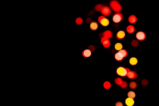 Fondo festivo con colorido bokeh sobre fondo negro copia fondo