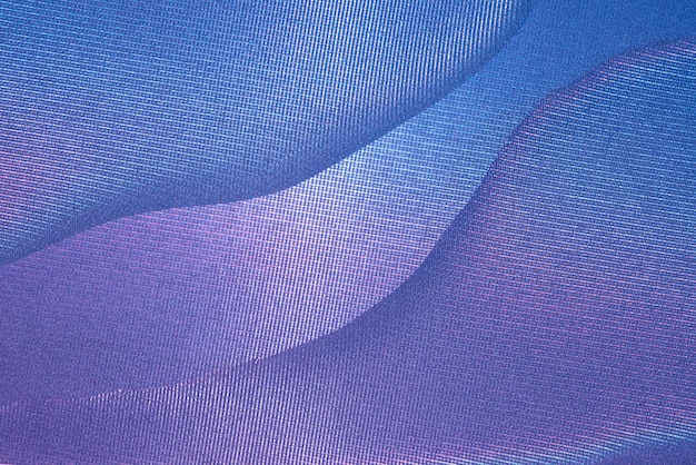 Fondo de fotografía abstracto azul y magenta con curvas y textura.