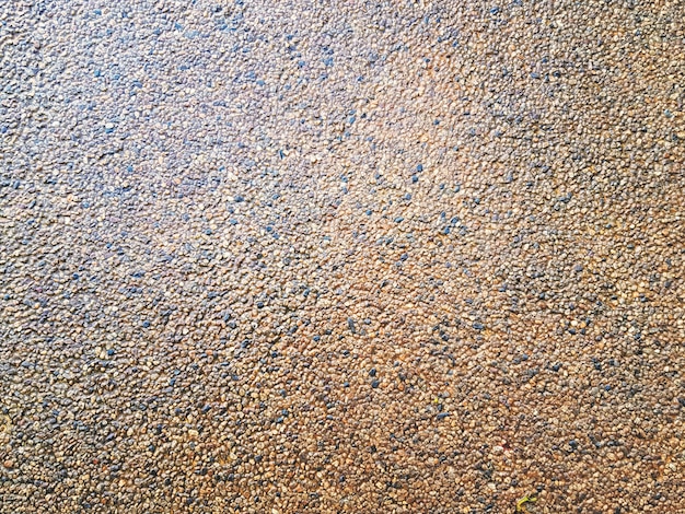 Fondo de fotograma completo de piso de piedra de grava pequeña húmeda