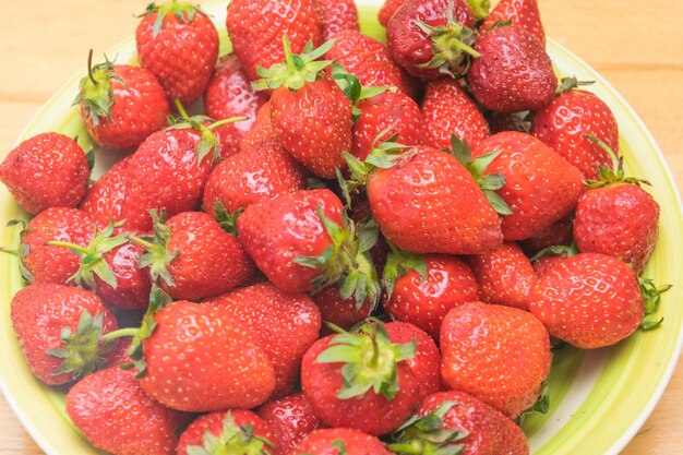 Fondo de fruta macro de bayas orgánicas frescas de fresa