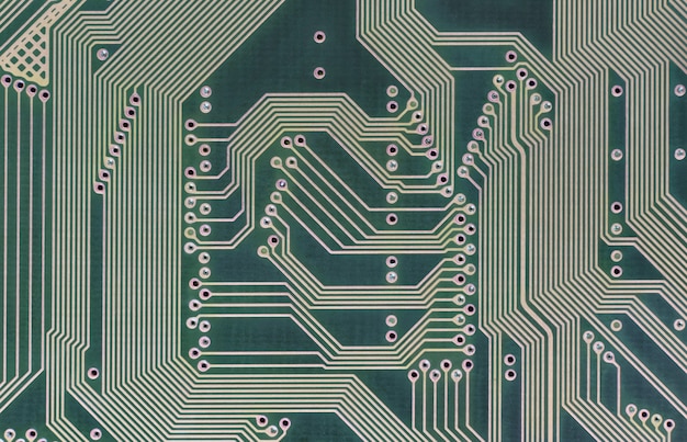 Fondo geométrico de tecnología de alta tecnología con la parte posterior de la placa de circuito. Cerca de una placa de circuito. Vista superior.