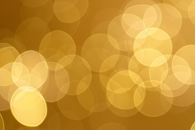 Fondo de gradación de Bokeh dorado radiante para agregar un toque de clase