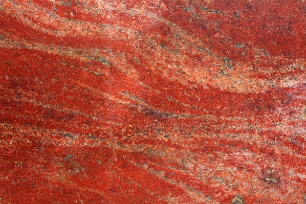 Fondo de granito rojo. Plantilla de diseño. una piedra natural