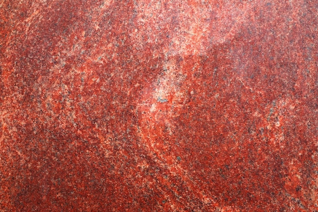 Fondo de granito rojo. Plantilla de diseño. una piedra natural