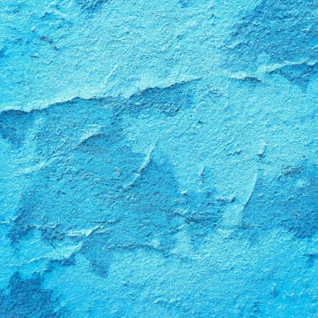 Fondo de grunge de pared azul abstracto con textura áspera pintada