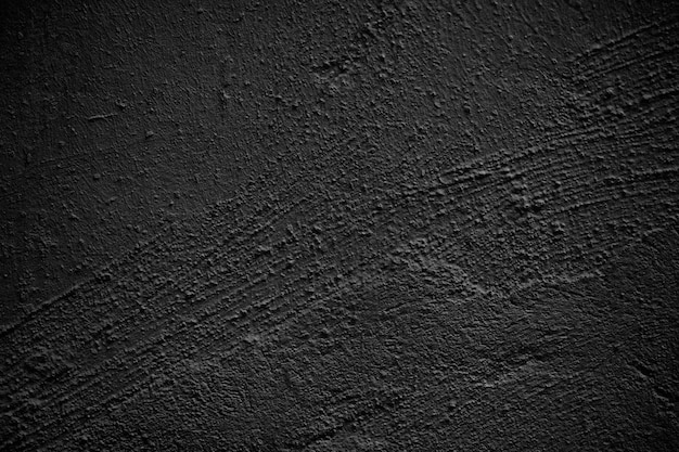 Fondo de grunge de pared rugosa enlucida negra