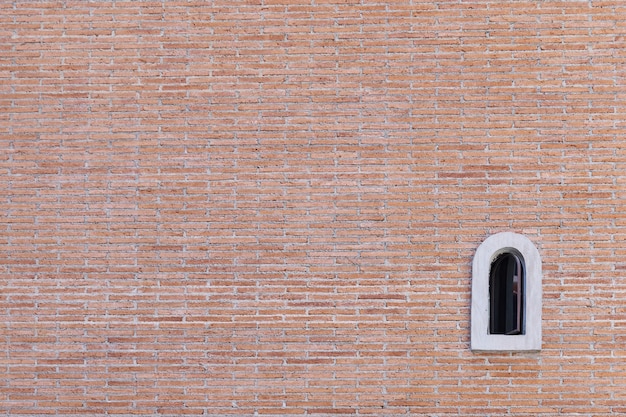 Foto fondo de grunge de textura de pared de ladrillo rojo con ventana